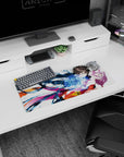 Anime couple mouse pad 28x12 inches showing a sharp-eyed boy catching a pink-haired girl amid swirling blue light.
