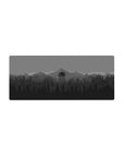 Mouse pad with a minimalist forest and watchtower design, 28x12 inches, offering a peaceful, sleek aesthetic.