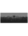 Compact 32x12 inches mouse pad with a minimalist forest and watchtower design, perfect for a calm, sleek workspace.