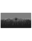 Mouse pad featuring a minimalist forest and watchtower design, 32x16 inches, for a sleek and calming workspace aesthetic.