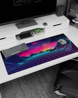 Artistic 36x16 inches desk pad with Neon Horizon Dreams, showcasing wireframe mountains and a glowing horizon against a surreal cosmic sky.
