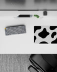 Playful 14x10 mouse pad featuring black and white cow print spots, perfect for adding fun and personality to your workspace