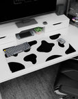Fun 32x16 mouse pad with bold black and white cow print design, adding a playful and whimsical touch to your desk setup