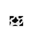 Cow print 14x10 mouse pad with bold black and white spots for a whimsical, playful aesthetic on your desk