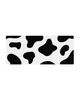 Cow print 28x12 mouse pad featuring bold black and white spots for a fun and playful touch to your workspace