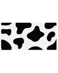 Cow print 32x16 mouse pad with bold black and white spots for a fun, playful aesthetic that adds whimsy and creativity to your desk