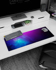 Star-speckled nebula scene 32x12 inches desk mouse pad with swirling clouds over a deep space backdrop.