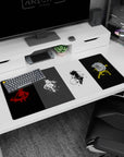 36x16 inches anime desk pad showing four cloaked sword fighters slashing across a paint-splattered scene.