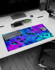 Modern 32x16 inches mouse pad featuring vibrant hexagonal patterns in blue, teal, and purple, with glowing effects for a stunning, dynamic vibe.