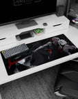 36x16 inches desk pad showing a crouched silver-haired swordsman, katana wide, hooded figure behind.