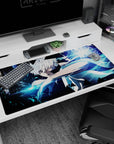 40x20 inches anime desk pad featuring a white-haired warrior in a sleeveless cloak, arm raised to strike.