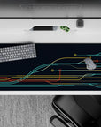 Sleek 36x16 desk pad featuring bold lines in teal, yellow, and red for a dynamic, futuristic circuit board design