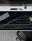 Tech-inspired 40x20 desk pad with bold curves in teal, yellow, and red, reminiscent of a futuristic circuit board design