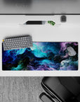 Intense 32x12 desk mat features swirling colors and vibrant tones with intricate galactic details for fans of mystery