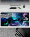 Dynamic 32x16 desk mat combines deep hues and flowing patterns for impactful yet calming visuals