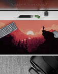Vibrant 40x20 desk pad with a glowing crimson sunset and scenic landscape, adding warmth and color to your daily tasks