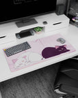32x16 inches anime mouse pad showing a white smiling cat and grumpy black cat lounging together.