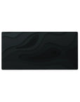 Mouse pad featuring Midnight Flow design, 32x16 inches, with abstract deep black wave patterns for a refined and understated workspace aesthetic.