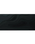 Desk pad featuring Midnight Flow design, 36x16 inches, with abstract black wave patterns for a minimalist, elegant workspace atmosphere.
