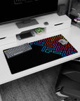 Modern 32x16 inches mouse pad showcasing neon geometric patterns in blue, purple, red, and yellow against a deep black background for vibrant energy.