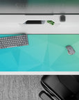 Tranquil 36x16 desk pad with teal and aqua gradient and soft, overlapping polygons for a peaceful, minimalist vibe