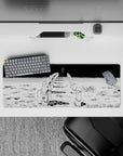 Manga horror 32x12 mouse pad with kneeling astronauts and an eerie, ominous figure for a dark and unsettling workspace atmosphere