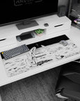 Unsettling 36x16 anime desk mat featuring kneeling astronauts and a stark manga aesthetic, ideal for creating a chilling and mysterious workspace