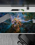 Teal-to-inky blue cosmic desk pad 40x20 inches with soft glow, calm night vibe, and smooth tracking.