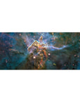 Cosmic nebula desk pad 36x16 inches with teal clouds, inky blues, and starry specks.