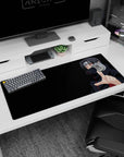Itachi Uchiha reaching out on an anime desk pad 36x16 inches, calm gaze with glowing Sharingan eyes.