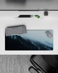28x12 inches mouse pad with a foggy forest, cool blues and greens blending for a serene, nature-filled workspace vibe.
