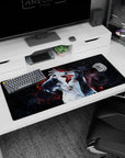 Anime desk pad 36x16 inches featuring a tattooed character with neon-red embers on deep-space black, moody and elegant.
