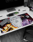 40x20 inches Naruto desk pad showing Naruto vs Sasuke, with Madara and Hashirama glaring across a stone face.