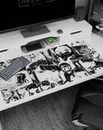 Wide-eyed chibi anime girls and sleepy smiles cover this 40x20 inches desk pad in repeating panels.