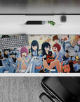 36x16 inches neon-bright anime desk pad in blues, creams, candy reds; chaotic cozy snack-time vibe.