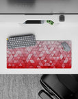 28x12 inches mouse pad with 3D geometric pattern, blending soft pinks and reds in a gradient for a minimalist yet bold aesthetic.