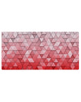 Mouse pad featuring 3D geometric pattern, 32x16 inches, with soft pinks and reds in a gradient for a visually striking, modern design.