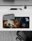 Deep navy and cloud-white with rusty amber accents, 28x12 inches mouse pad with calm night-sky vibe.