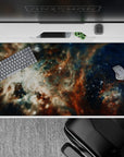 Calm night-sky desk pad 40x20 inches in deep navy, cloud-white haze, and rusty amber tones.