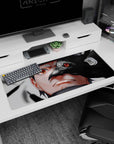 36x16 inches anime desk pad showing Sasuke’s Sharingan eye as a crow cuts across his face, eerie vibe.