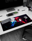 Anime desk pad 36x16 inches showing a pale-haired girl beside a crimson-hooded girl on black.