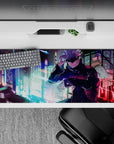 36x16 inches desk pad showcasing Satoru Gojo with his cool confidence, set against a vibrant neon cityscape from Jujutsu Kaisen.