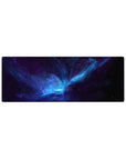 Nebula galaxy desk mouse pad 32x12 inches with swirling stardust and electric blue-purple core.