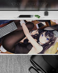 Cozy flirty violet-and-black anime desk pad 40x20 inches, warm wood floor vibe with bold color pop.