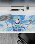 Anime desk pad featuring Aqua from KonoSuba, 36x16 inches. Bright sky blues and greens, perfect for gaming or work.
