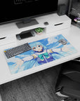 Anime mouse pad featuring Aqua from KonoSuba, 32x16 inches. Bright blues and greens, capturing her joyful and welcoming spirit.