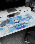 Anime desk pad 40x20 inches featuring Aqua from KonoSuba with open arms, blue skies, and vibrant colors, perfect for gaming.