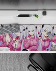Cozy blush pink anime desk pad 36x16 inches with bright blue eyes, hoodie vibe, crisp gaming mood.