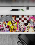 Chaotic cute pink splashes on black-and-white checkers, loud gaming desk pad 36x16 inches.