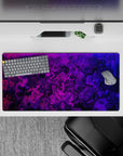 Energetic 32x16 desk mat combines deep purple and electric pink lines for impactful yet artistic visuals